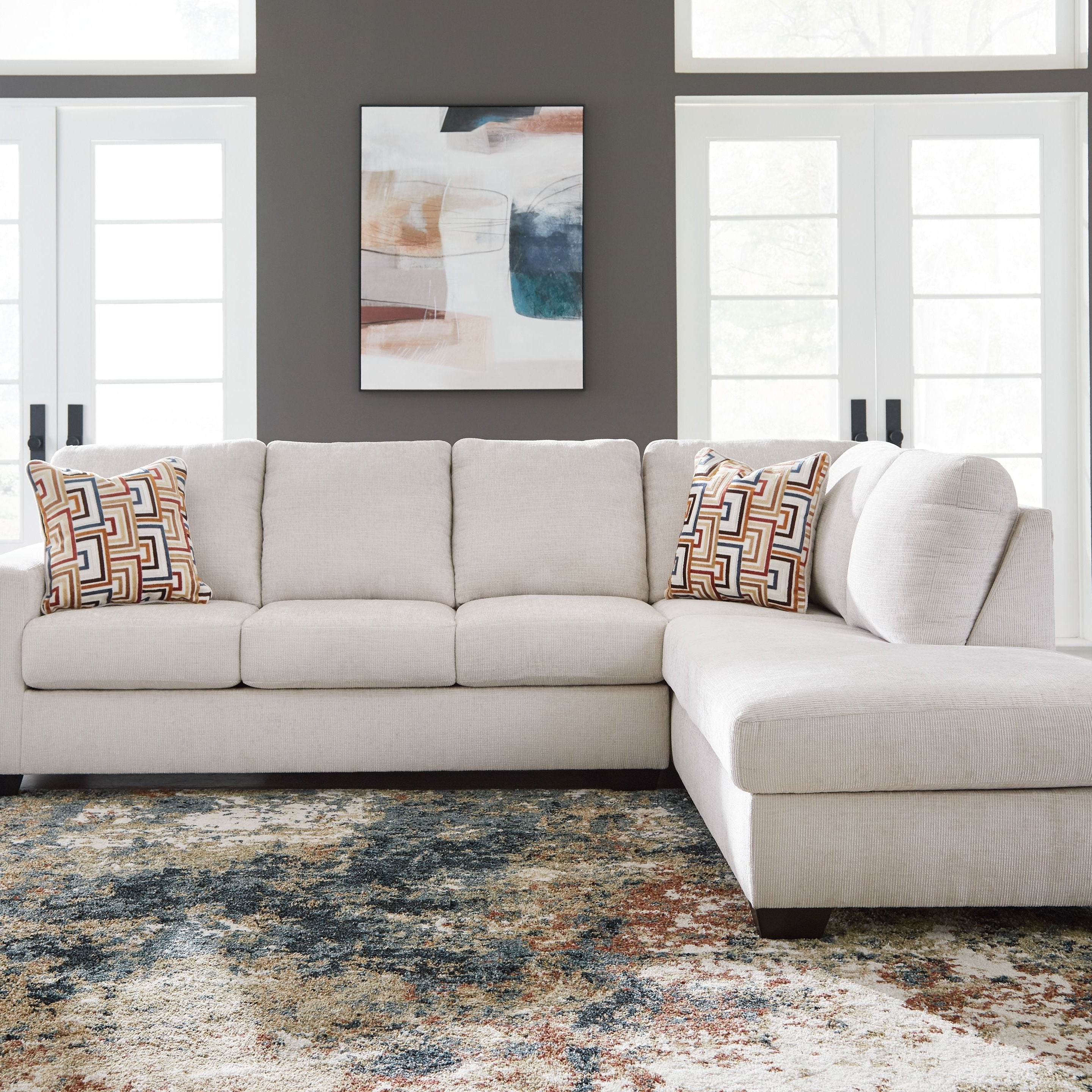 Beige L-Shaped Corner Sofa with Chaise Longue and Decorative Throw Pillows